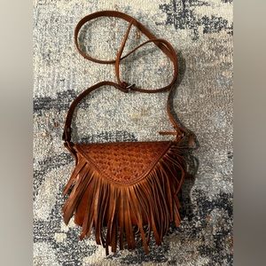 Handcrafted fringe leather handbag